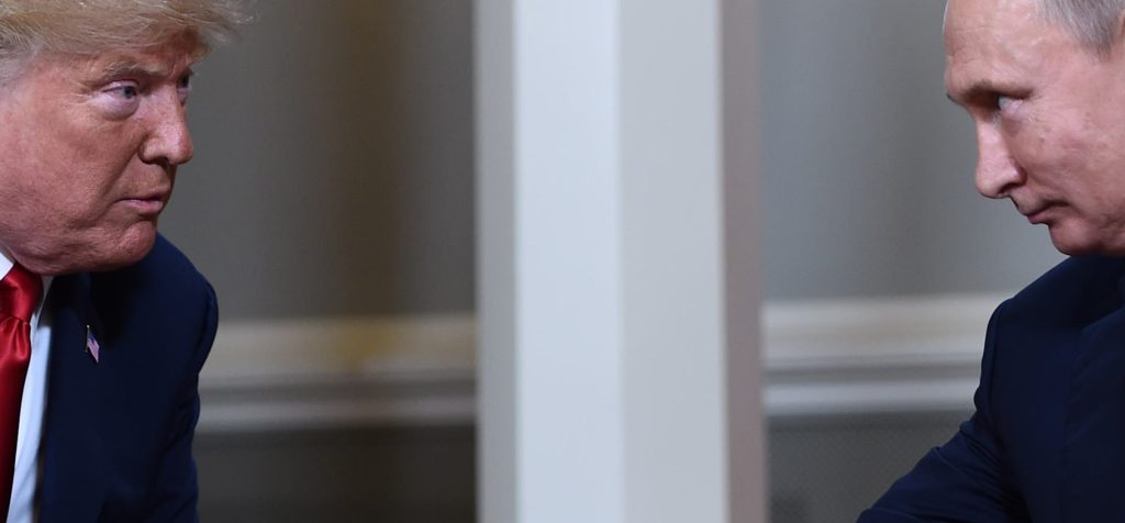 US President Donald Trump and Russian President Vladimir Putin shake hands ahead a meeting in Helsinki, on July 16, 2018.
