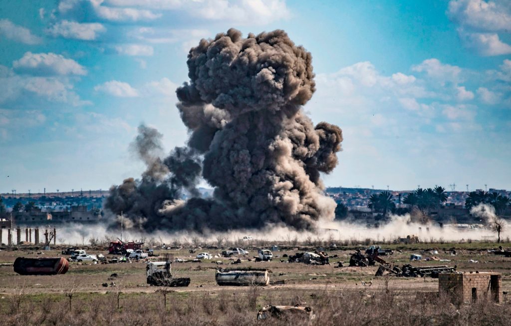 Smoke billows after shelling on the Islamic State group's last holdout of Baghouz, in the eastern Syrian Deir Ezzor province on March 3, 2019. (Photo by DELIL SOULEIMAN/AFP via Getty Images)