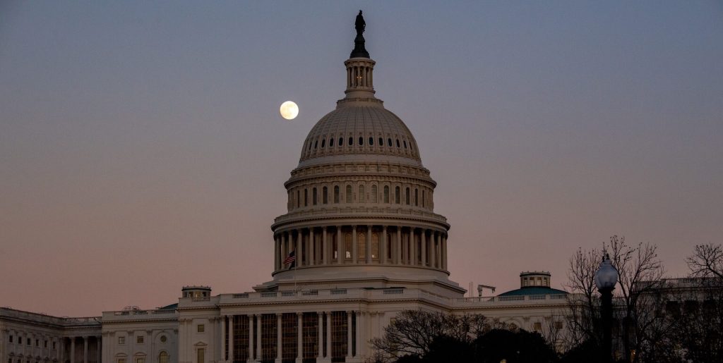US Capitol building at sunset with moon