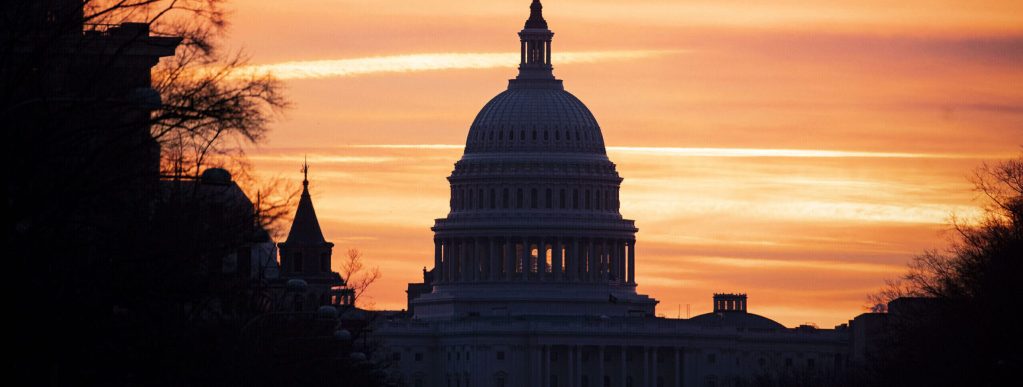The U.S. Capitol Building against a sunset