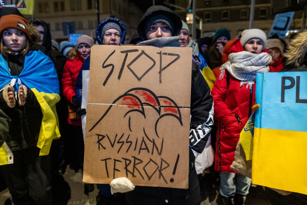 Demonstrators take part in a protest in front of the European Commission representation in Warsaw demanding more restrictive sanctions against Russia and arms supplies for Ukraine on January 8, 2024. (Photo by WOJTEK RADWANSKI/AFP via Getty Images)