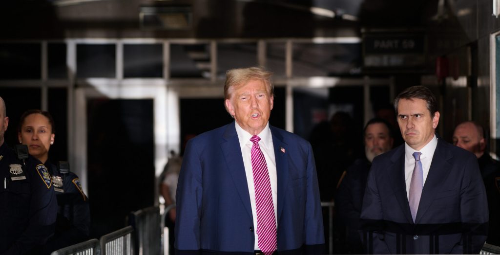 Former U.S. President Donald Trump speaks to the media as he exits the courtroom for the day at Manhattan Criminal Court
