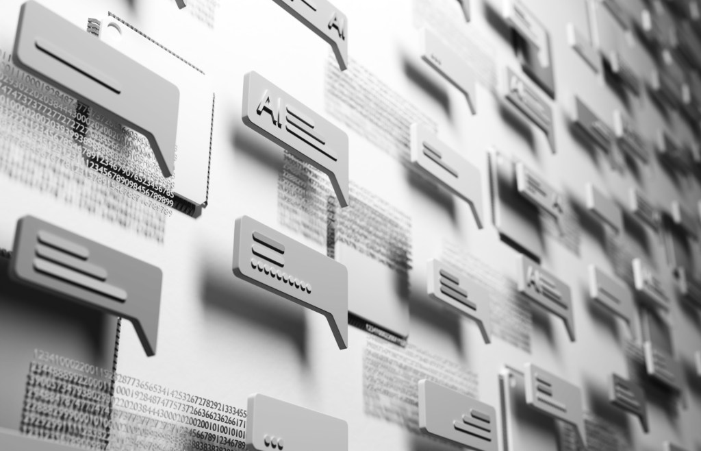 Conceptual and abstract digital generated image of multiple AI chat icons hovering over a digital surface with shallow depth of field in white and gray tones