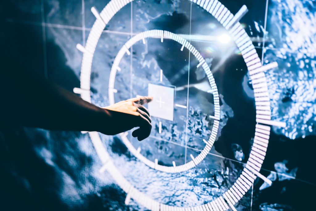 A person touches a digital screen