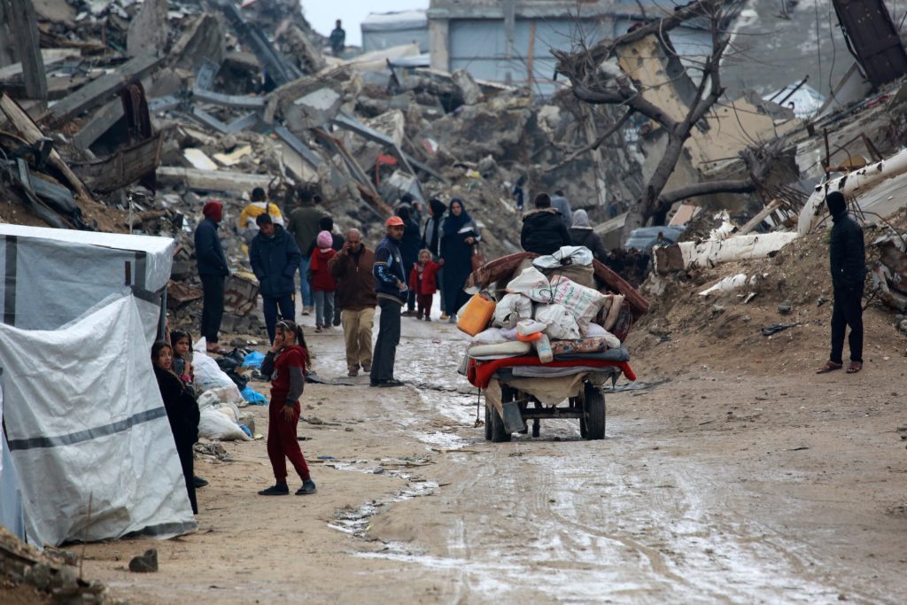 Palestinians flee with their belongings Beit Lahia in the northern Gaza Strip