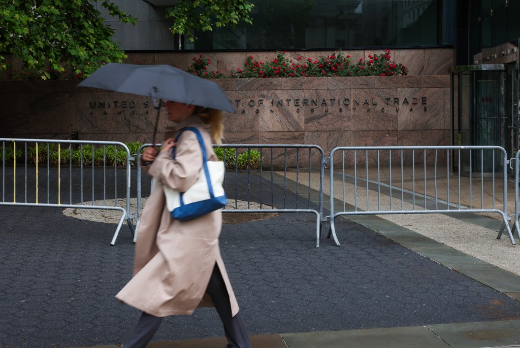 A person walks past the The United States Court of International Trade
