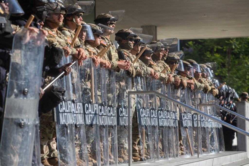 California National Guard members stand guard outside the Federal Building as protests continue in response to federal immigration operations in Los Angeles on June 10, 2025. (Photo by APU GOMES/AFP via Getty Images)