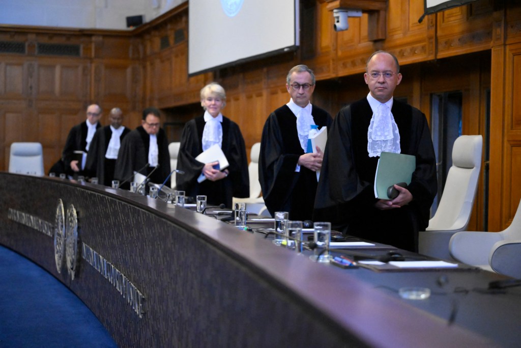 The International Court of Justice (ICJ) members arrive to issue first Advisory Opinion (AO) on States' legal obligations to address climate change, in The Hague on July 23, 2025. The top UN court on July 23, 2025 described climate change as an "urgent and existential threat", as it handed down a landmark ruling on the legal obligations of countries to prevent it. (Photo by JOHN THYS/AFP via Getty Images)
