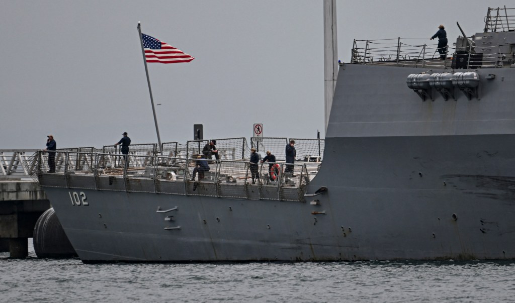 Crew members of the US Navy warship USS Sampson (DDG 102) are pictured at the Amador International Cruise Terminal in Panama City on September 02, 2025. Venezuelan President Nicolas Maduro said on September 1, 2025, that eight US military vessels with 1,200 missiles were targeting his country, which he declared to be in a state of "maximum readiness to defend" itself. (Photo by MARTIN BERNETTI/AFP via Getty Images)