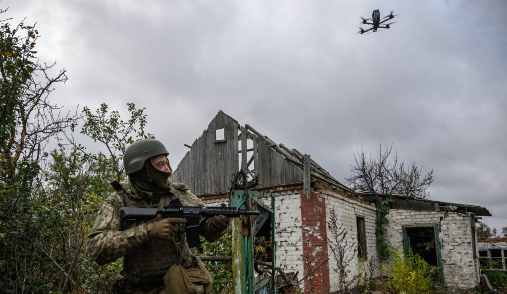 An infantry recruit of the 28th Seperate Mechanized Brigade runs from a simulated drone attack during a basic training course at an undislosed location in eastern Ukraine on October 11, 2025. (Photo by ED JONES/AFP via Getty Images)