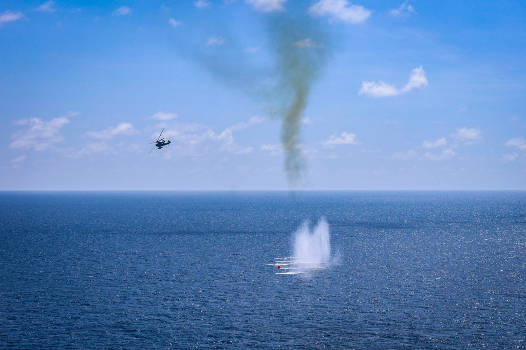 CARIBBEAN SEA - SEPTEMBER 22: In this handout provided by the U.S. Navy, An AH-1Z Cobra, assigned to Marine Medium Tiltrotor Squadron (VMM) 263 (Reinforced), fires an air-to-ground missile (AGM) 114N during a live-fire exercise on September 22, 2025 in the Caribbean sea.
