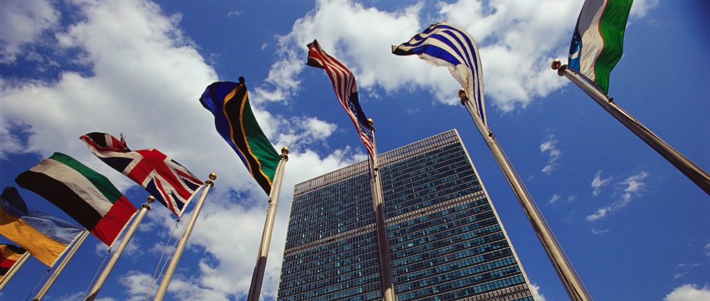 Flags fly outside the General Secretariat Building at the United Nations Headquarters.