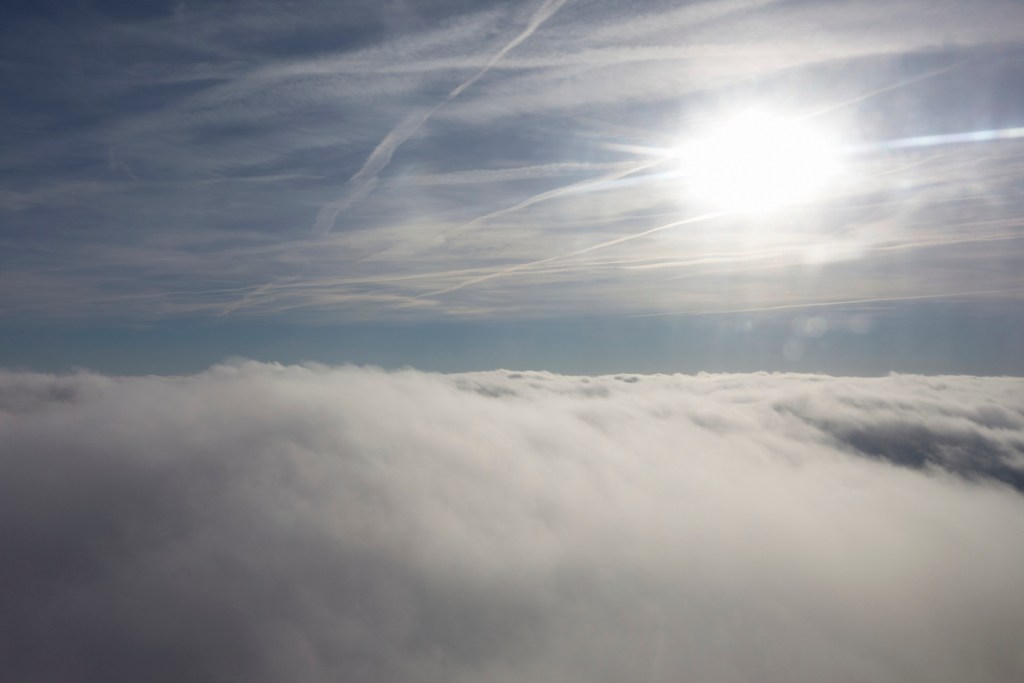 A photo of the clouds and sun