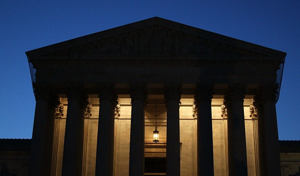 The U.S. Supreme Court at night.