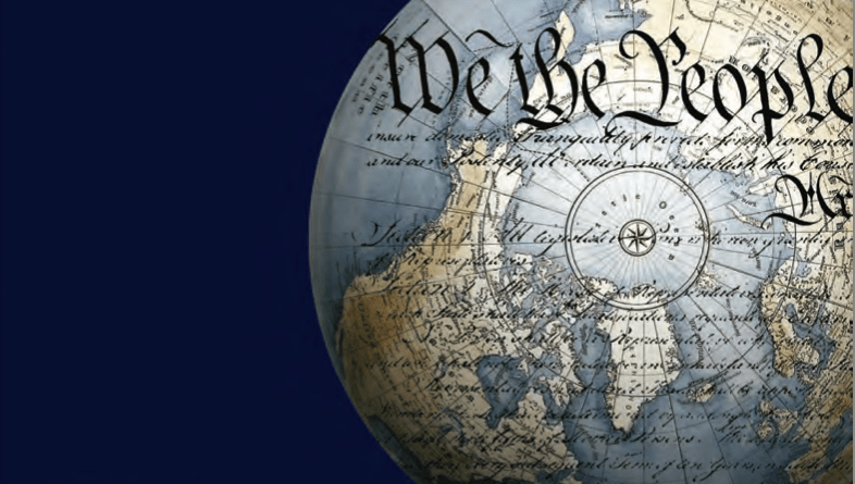 A stylized globe map over which the words 'We the People' are imposed.